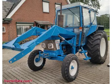 Ford 6410 com cabine e carregadeira.